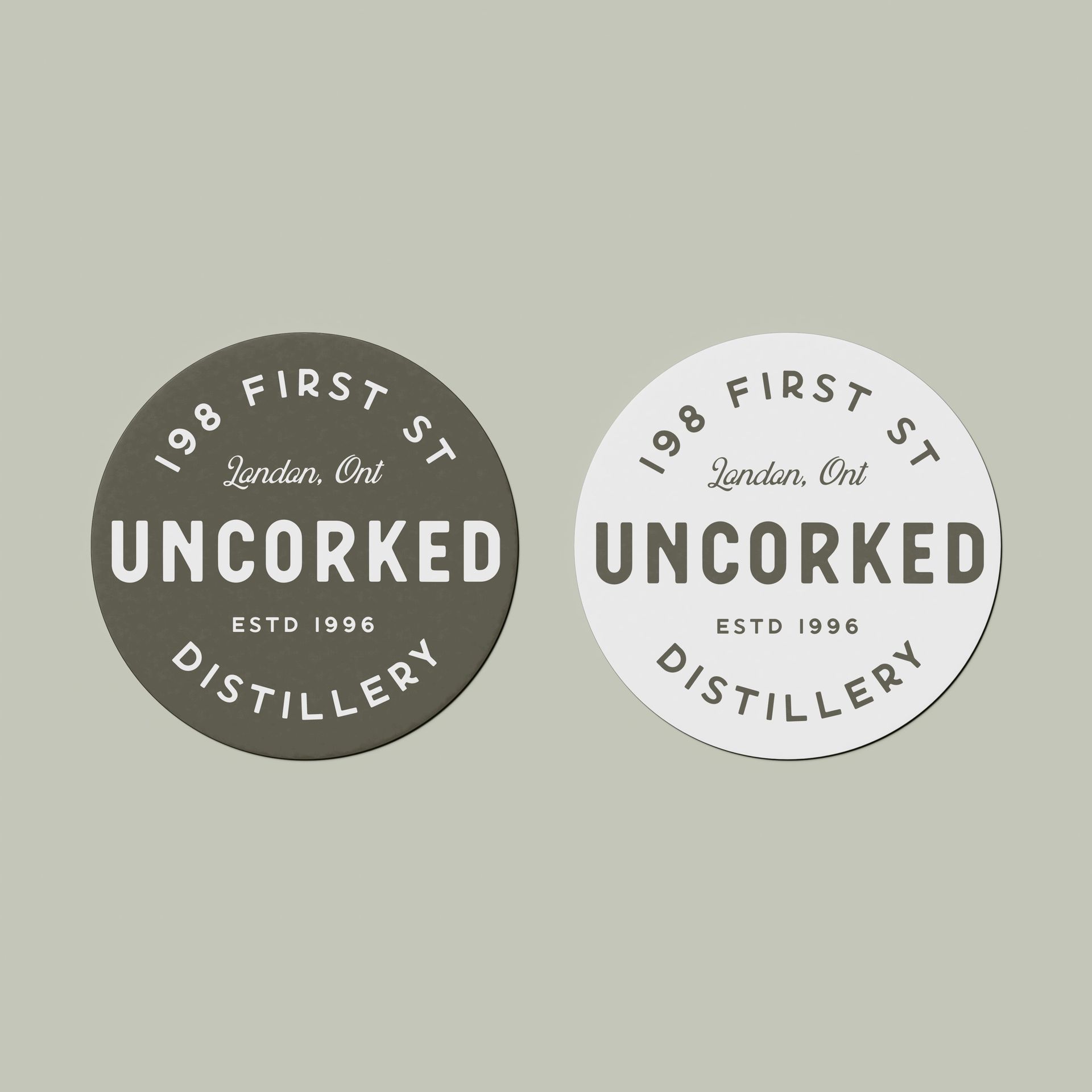 Two circles with the words uncorked distillery on them showing logos for small business