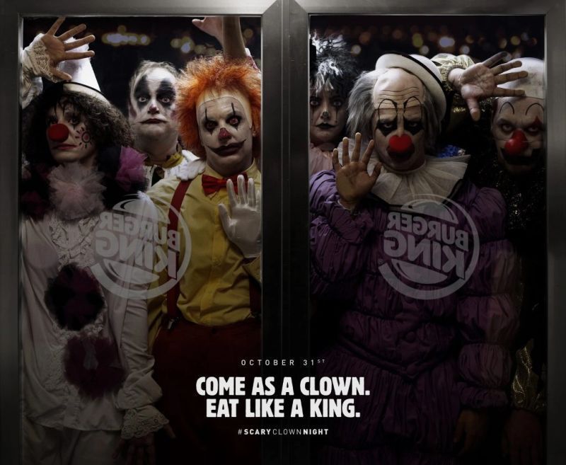 Clowns looking throw a window from Burger King Halloween Advertising