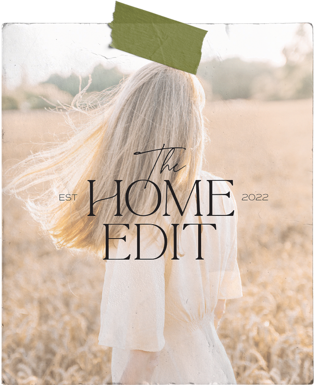 A woman with long blonde hair is standing in a field with a green tape on her head.