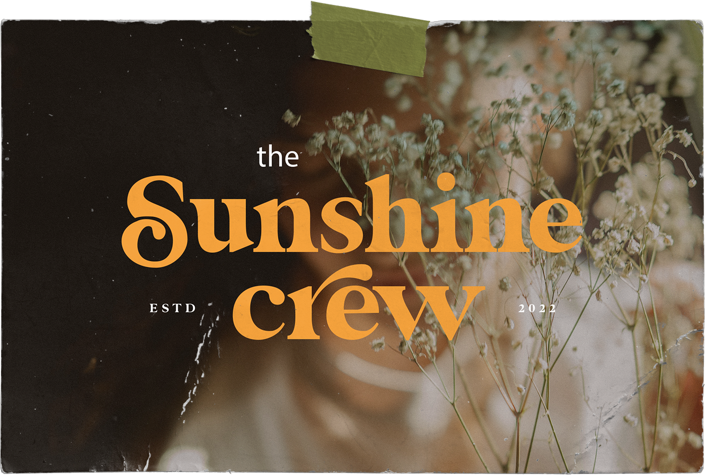 A poster for the sunshine crew with flowers in the background.