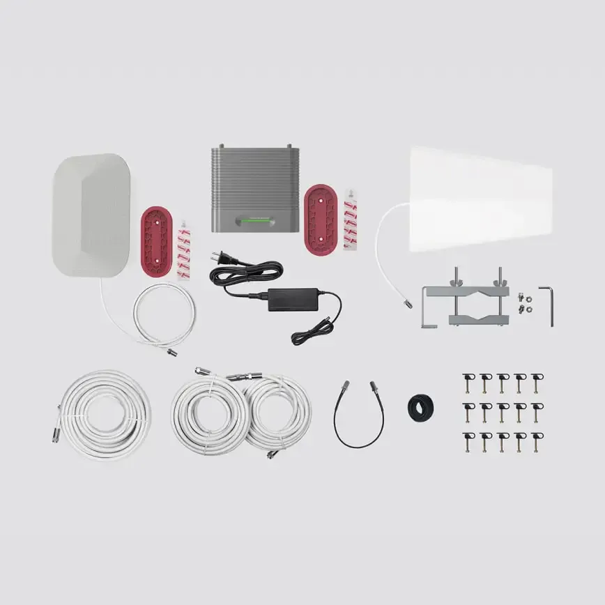 Assortment of components for a system, including antenna, cables, power supply, and control units, on a neutral background.