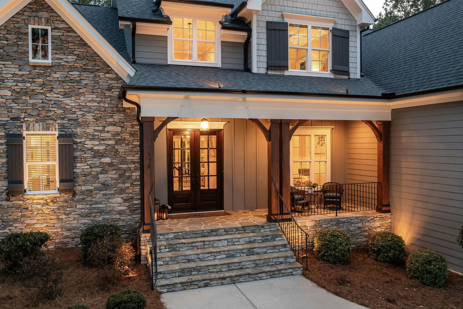 Red brick wall with horizontal mortar lines and a small dark stain near the bottom right