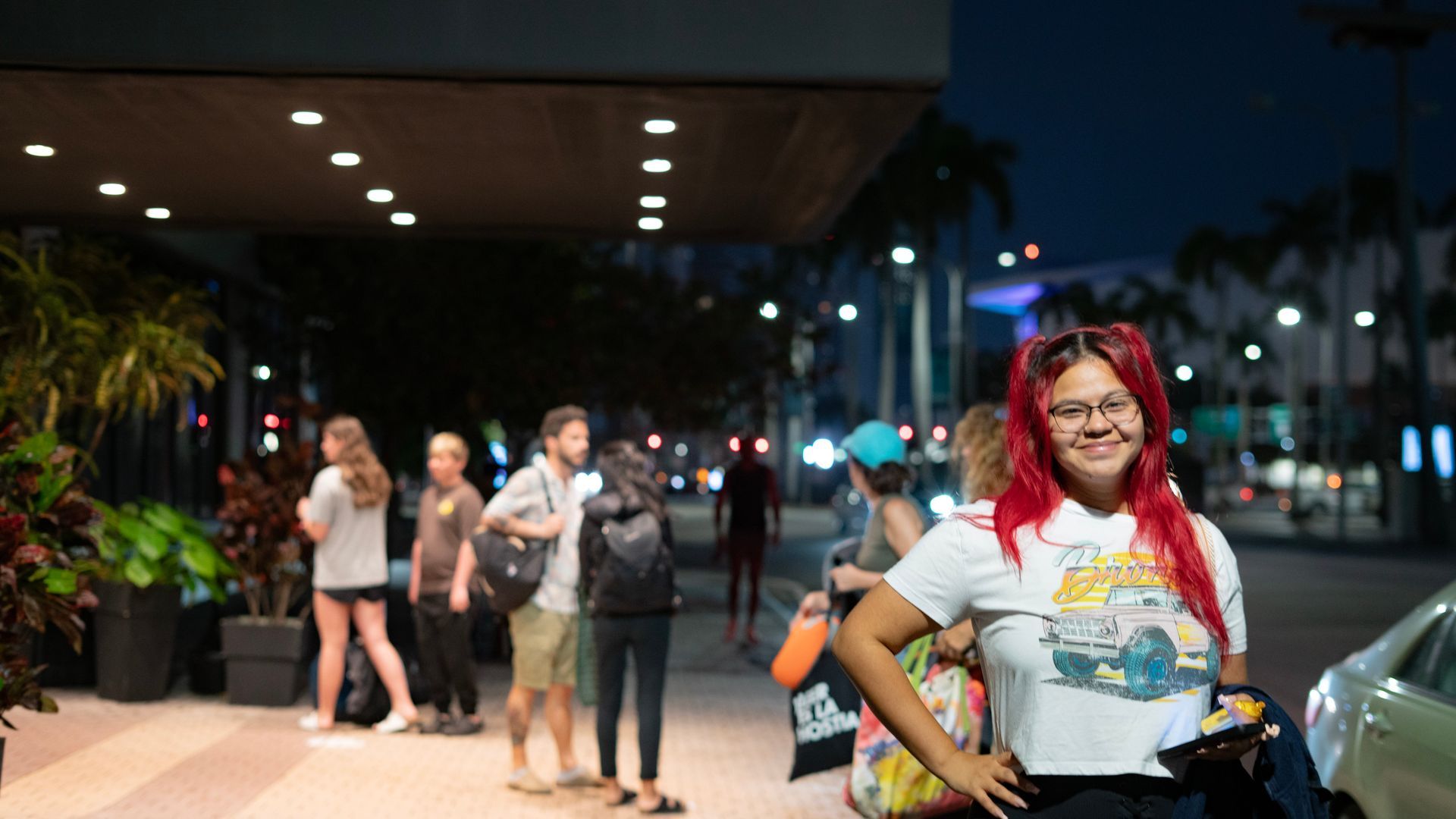 Smiling traveler ready for a Florida Keys adventure at early morning Miami bus tour departure