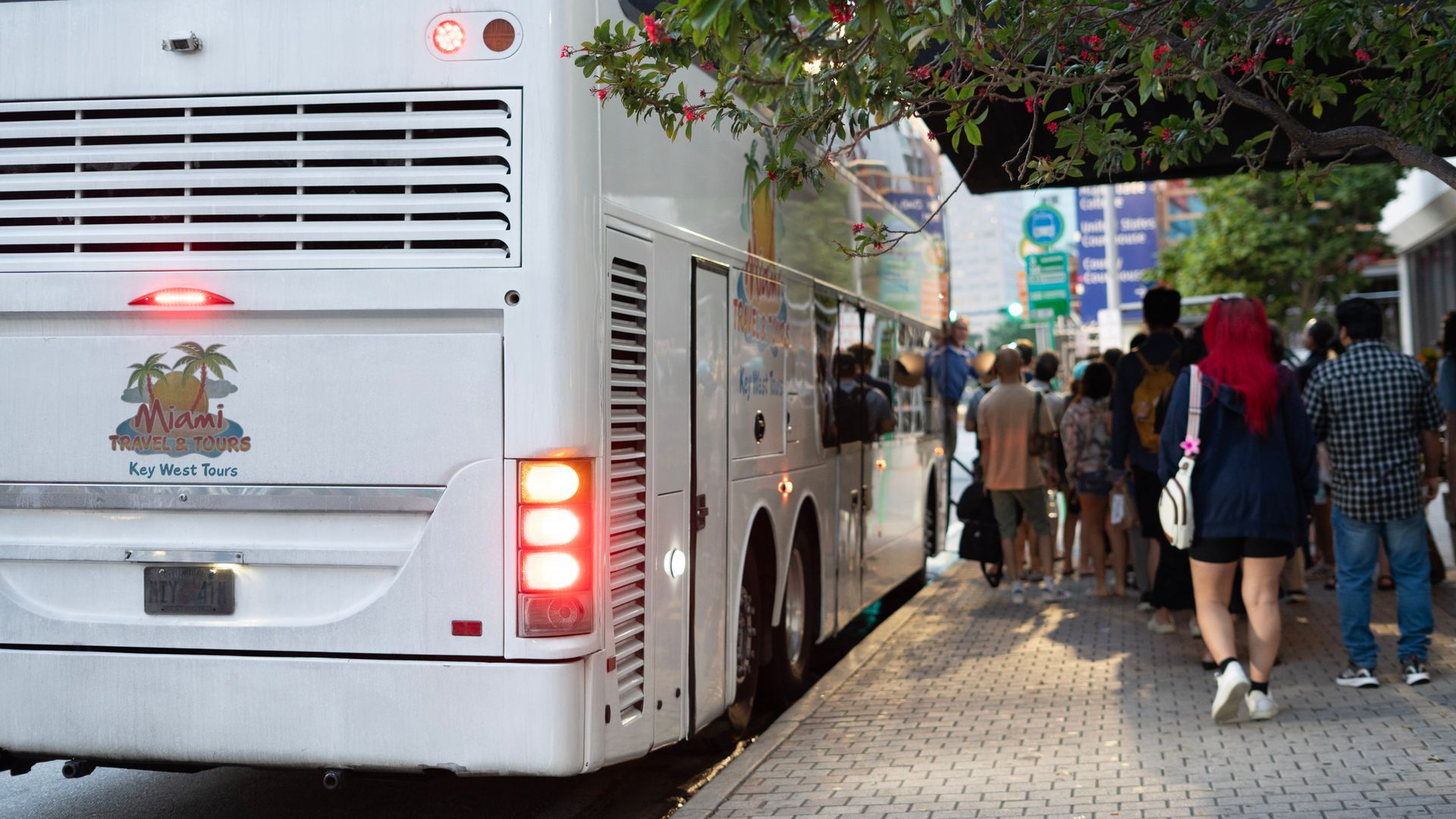 Travelers boarding the Miami to Key West tour bus in Downtown Miami, ready for their scenic Miami to Key West adventure along the famous Overseas Highway