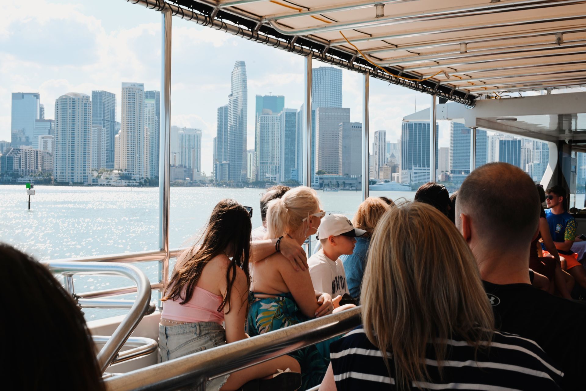 Guests enjoying a Star Island and Skyline Miami Boat Tour with views of Downtown Miami from Bayside
