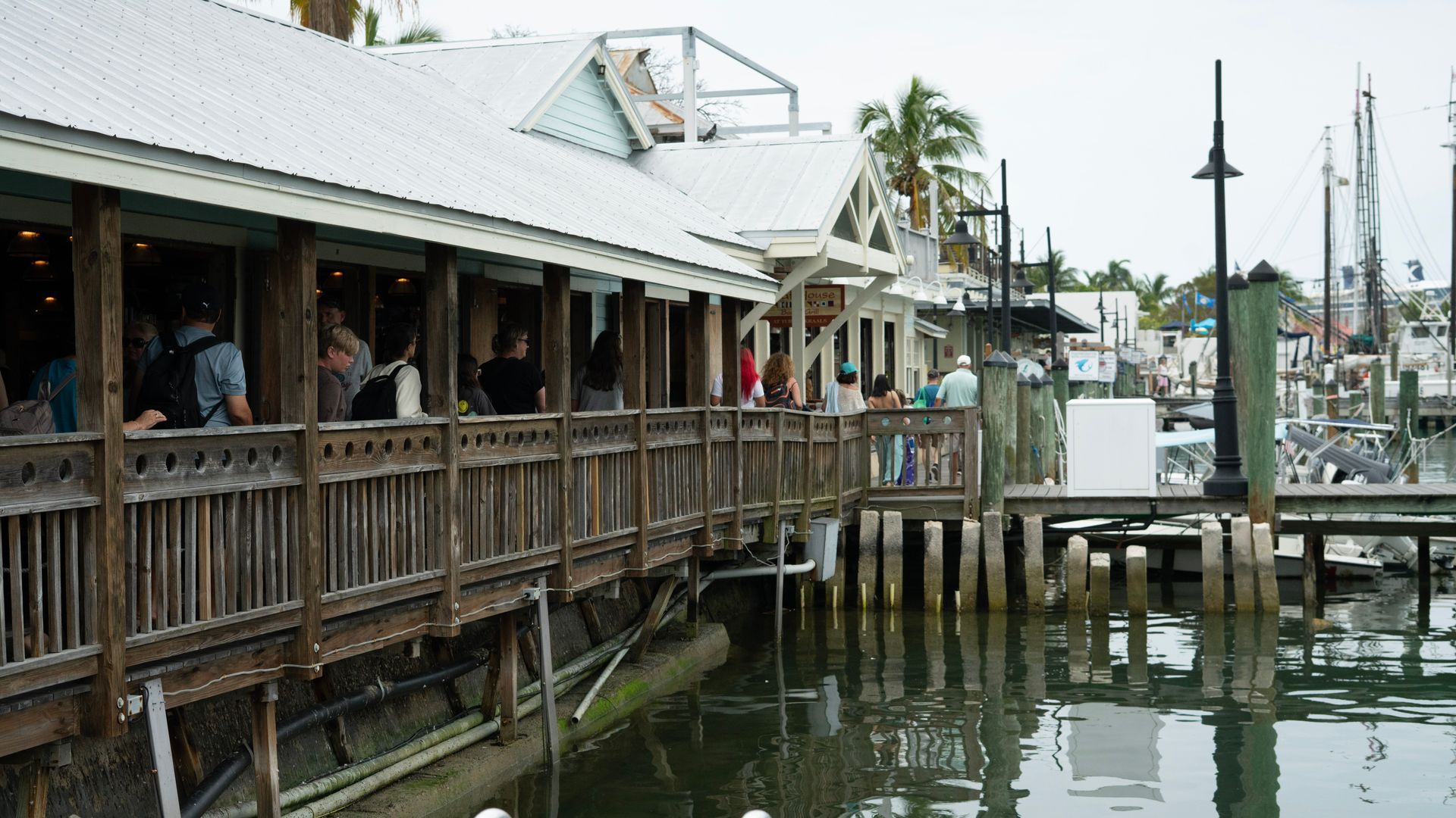Guests enjoying waterfront dining at one of Key West’s iconic dockside restaurants, a popular stop on the Florida Keys tour