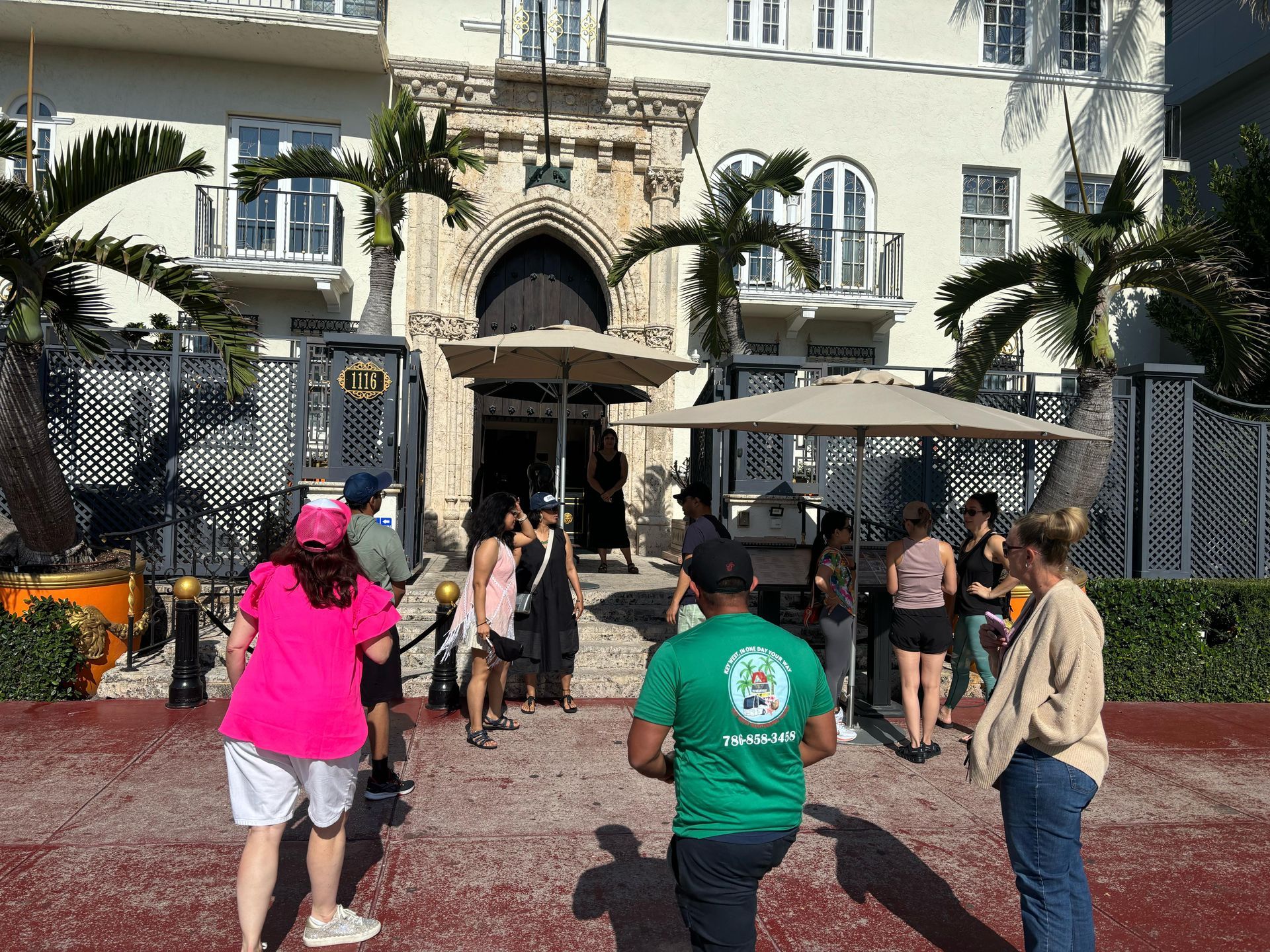 The Miami 5 in 1 city tour in ocean drive with passengers and tour guide taking photos on the half day Miami experience. 