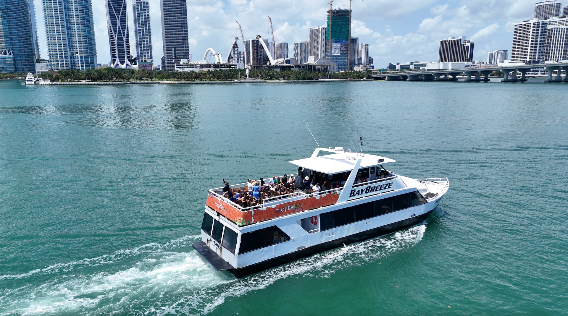 Mansion boat tour in Miami, heading to star island passing by the Miami Skyline