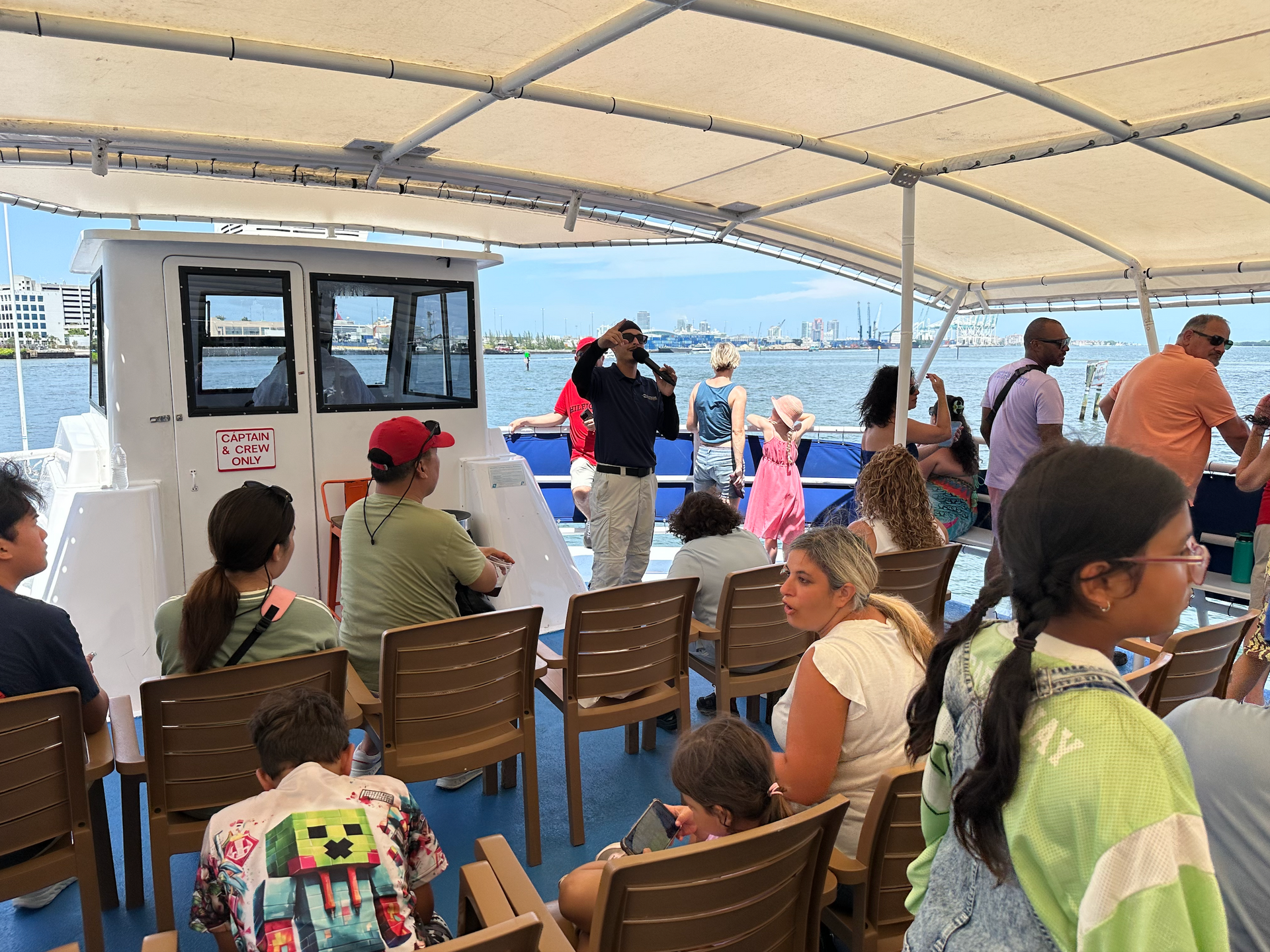 Tour guide doing Miami Sightseeing on the open top deck