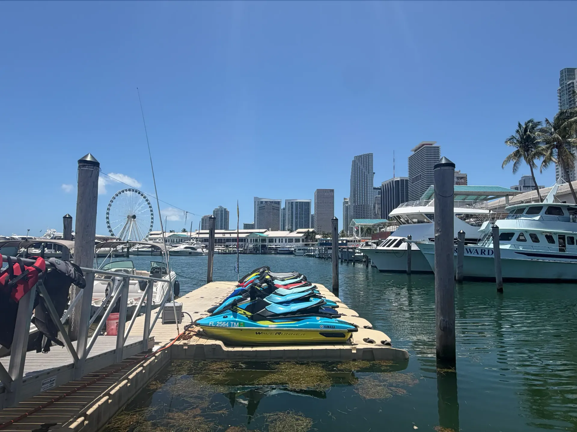 Jet ski fleet docked at Bayside Marketplace with views of Downtown Miami and Biscayne Bay