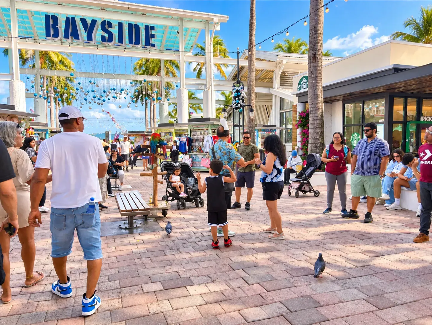 Visitors and families exploring Bayside Marketplace in Downtown Miami.