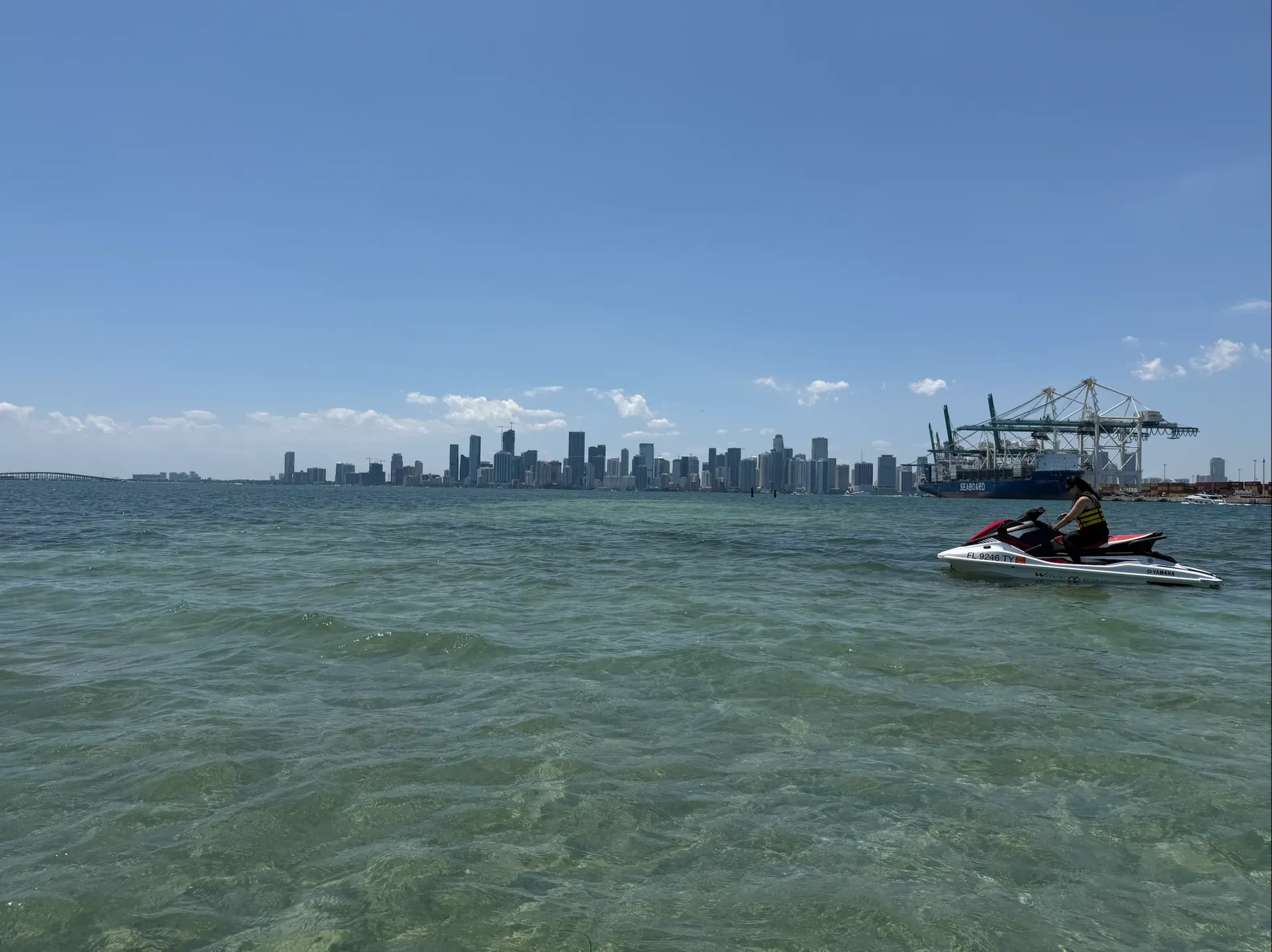 Guest enjoying Bayside Miami jet ski rides with the Downtown Miami skyline in the background
