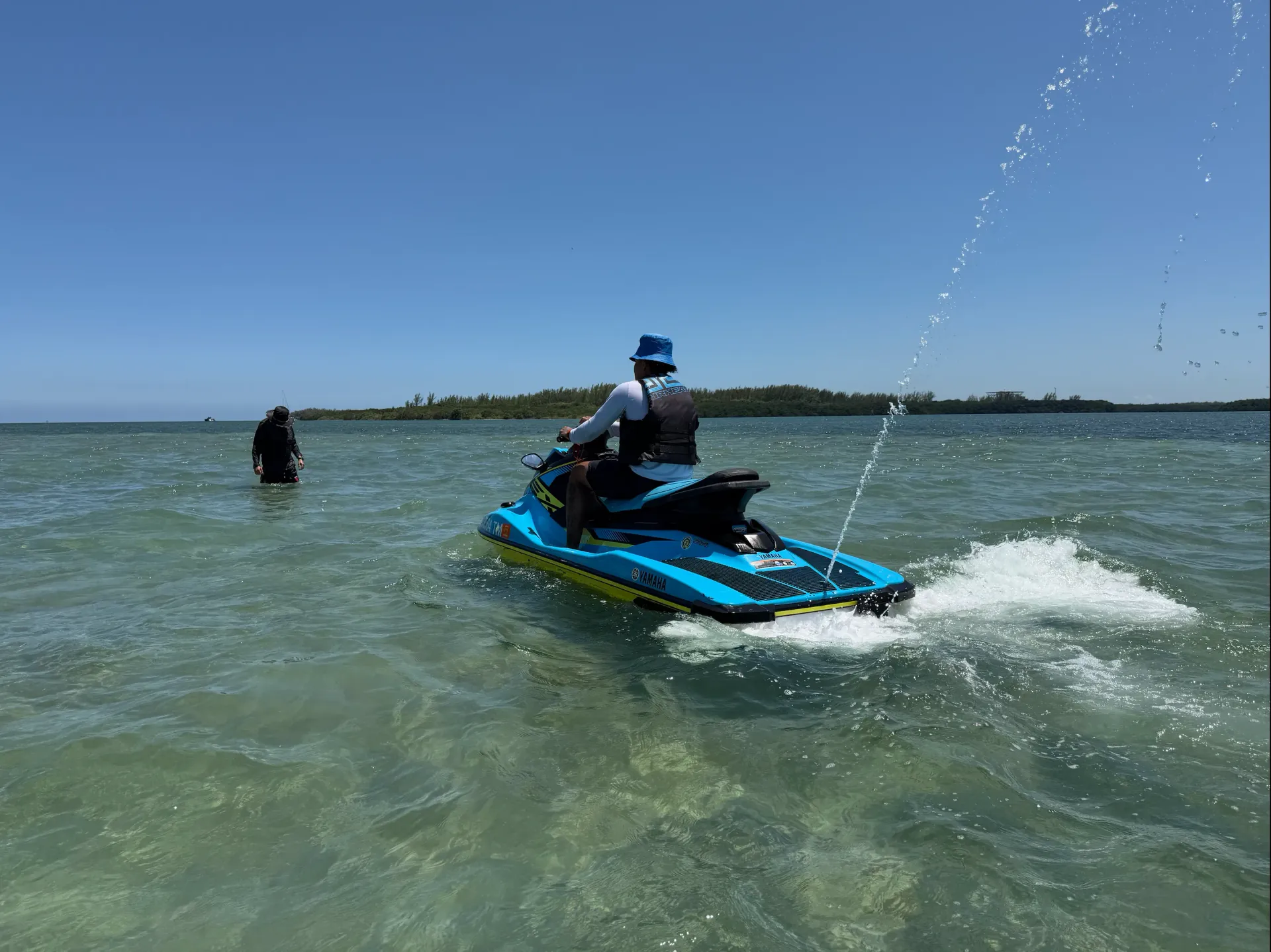 Jet ski rider exploring shallow water at the Fisher Island Sandbar on Biscayne Bay