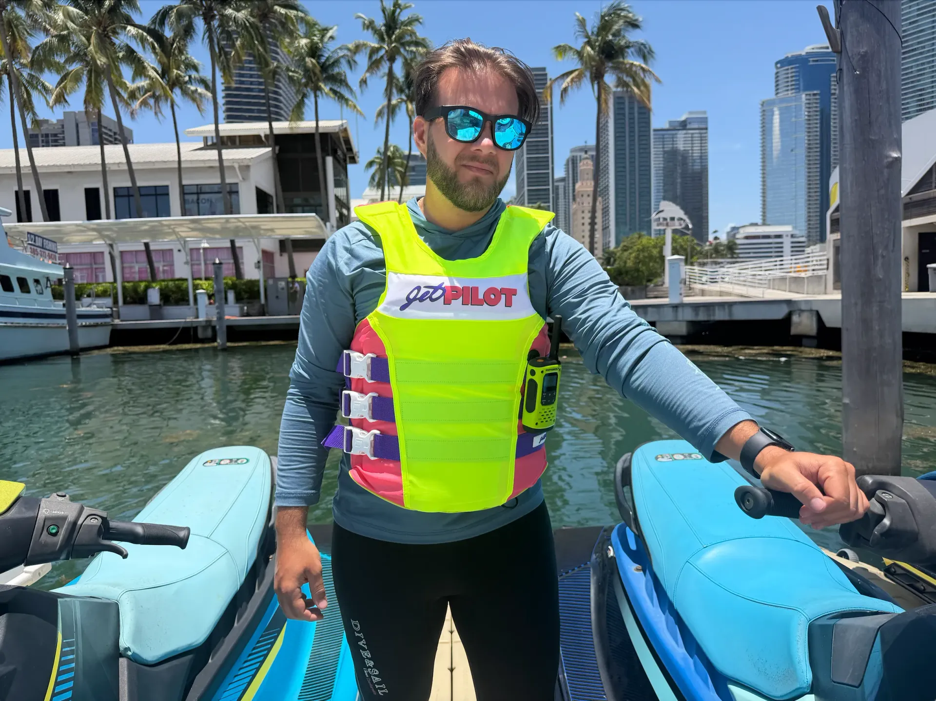 Professional pilot preparing guests for a guided jet ski adventure across Biscayne Bay from Bayside Marketplace