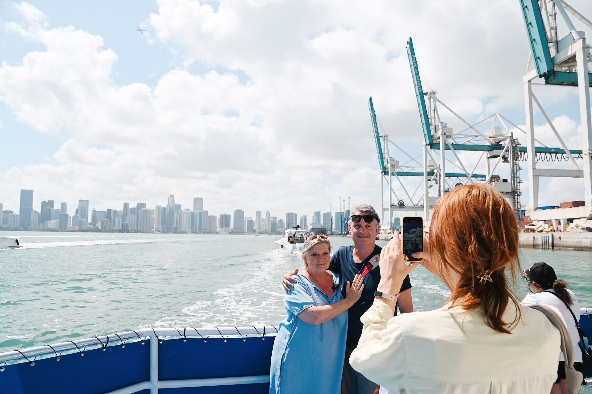 Guest taking photos with the Miami Skyline in the background