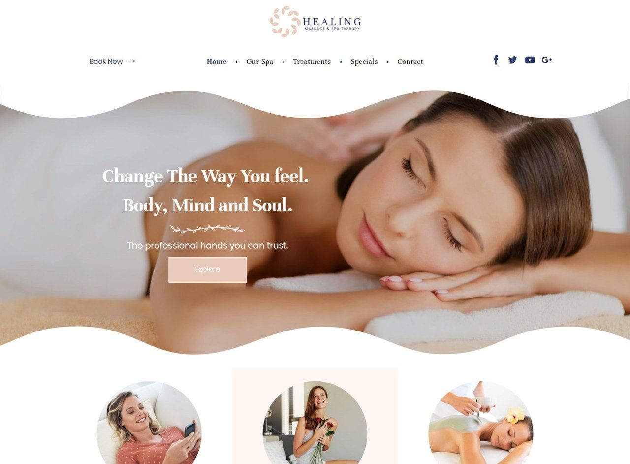 A woman is laying on a bed getting a massage.