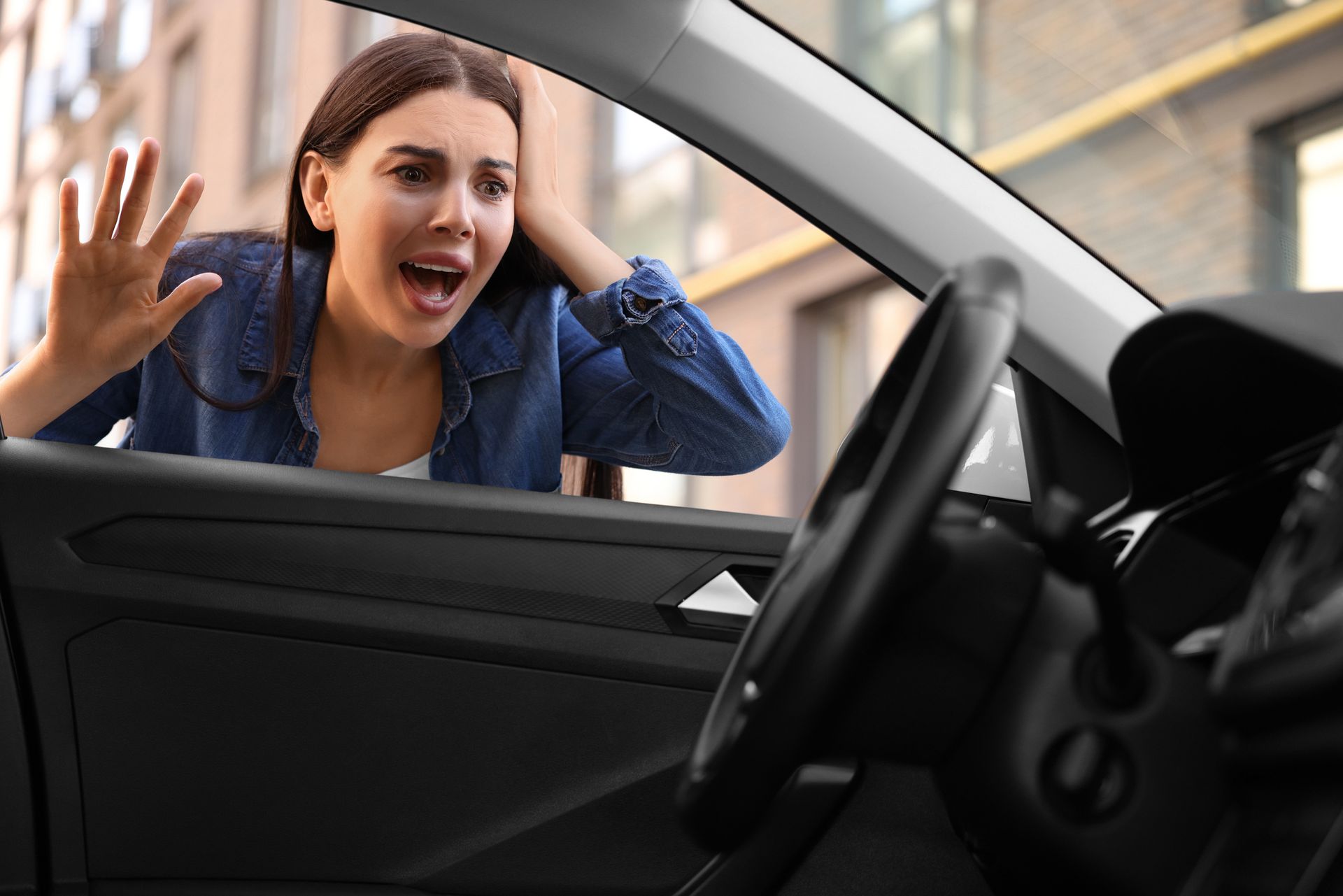 A woman is stressed, locked out of her car. A woman is stressed, locked out of her car.