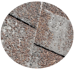 Close-up of speckled gray and brown stone pavers with diagonal grout lines Close-up of speckled gray and brown stone pavers with diagonal grout lines