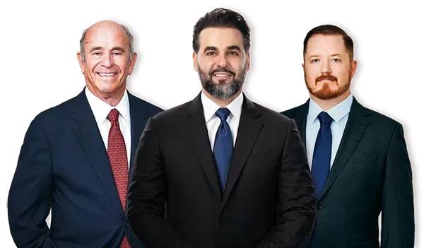 Three men in suits and ties are standing next to each other