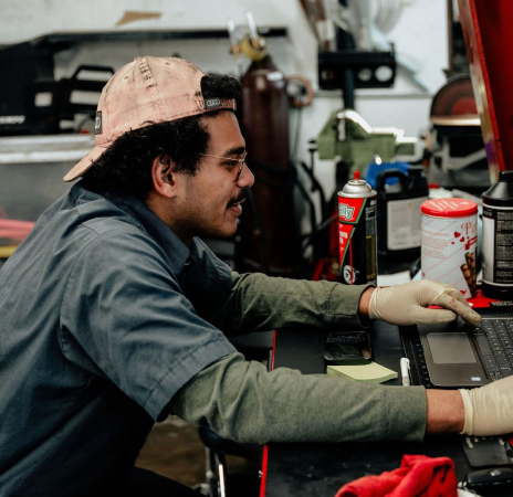 Our mechanic is diagnosing a vehicle on a laptop in Centennial, CO | Asian Imports Auto Repair