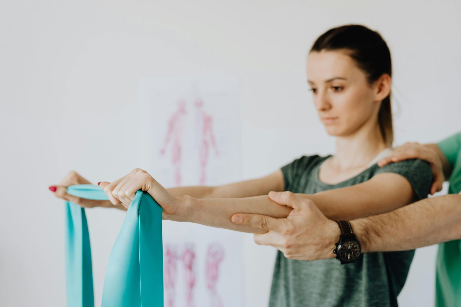 A Woman Is Doing Exercises with A Resistance Band — Burwood Back Pain in Strathfield, NSW