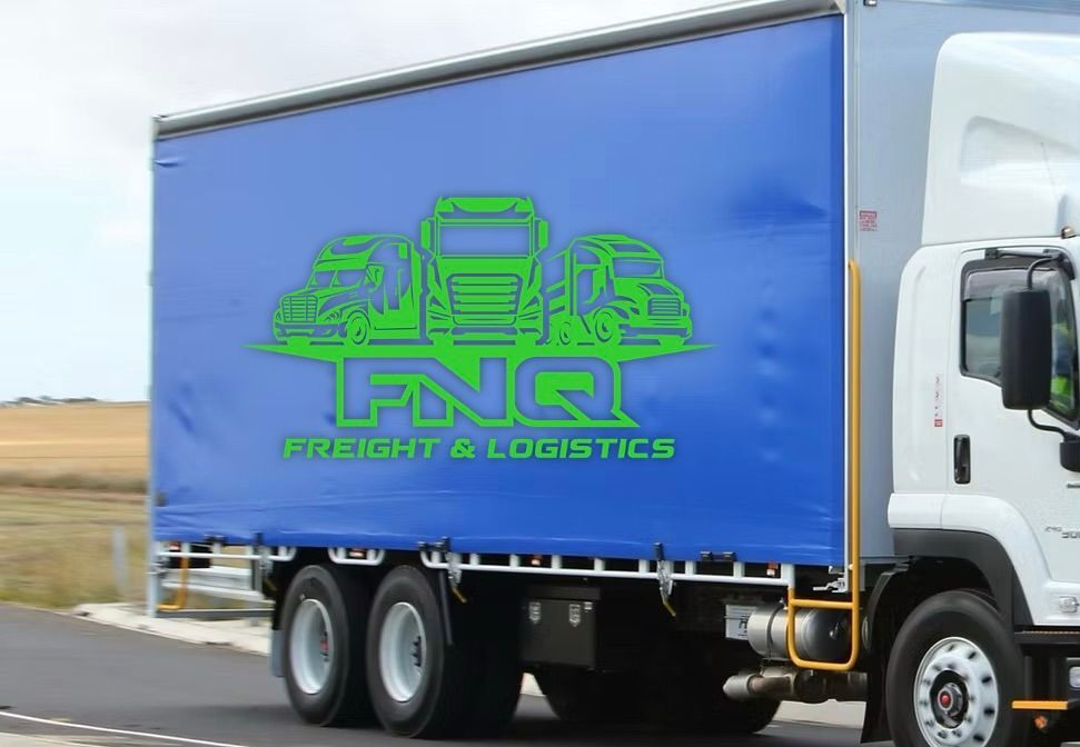 A white FNQ Freight & Logistics truck driving on a road. — FNQ Freight & Logistics In Portsmith, QLD