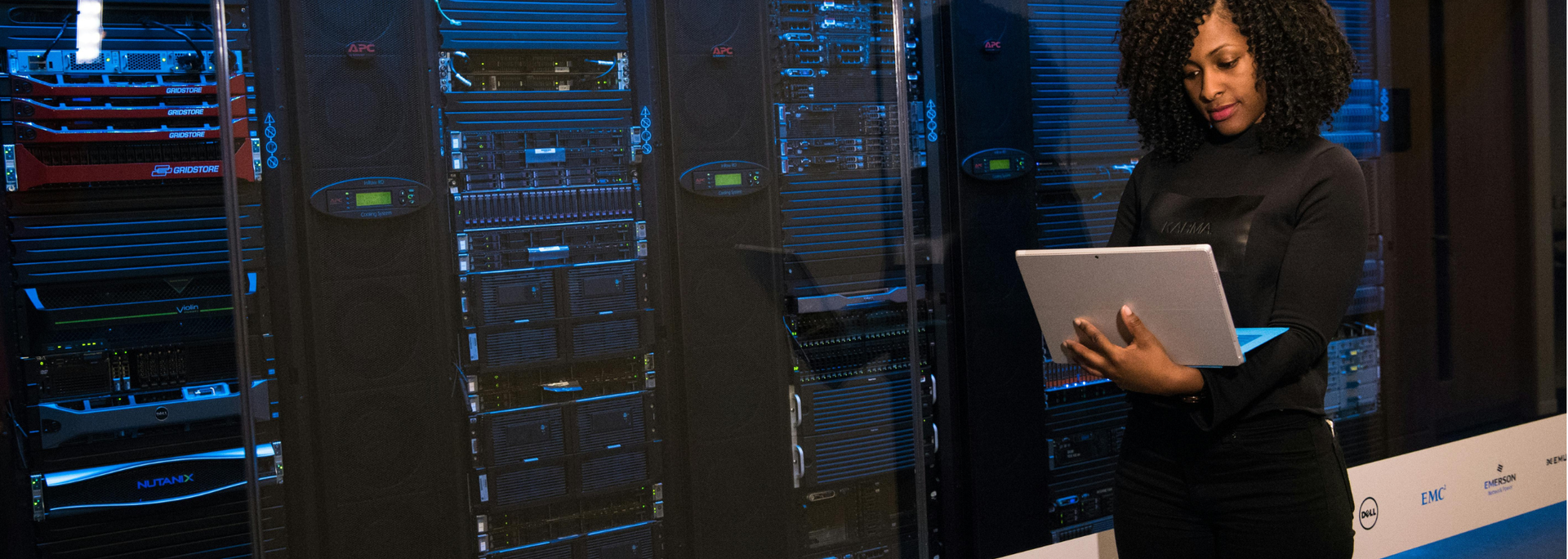 Picture of someone maintaining a server. 