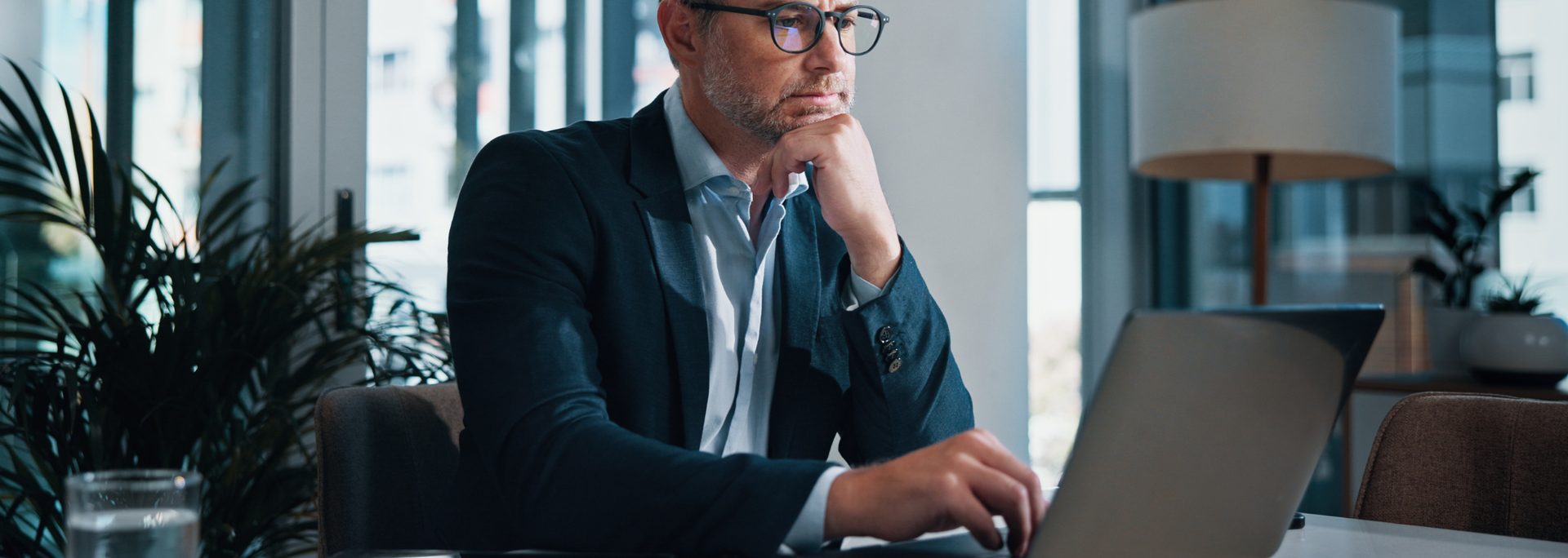 Picture of a business man on a computer. Picture of a business man on a computer.