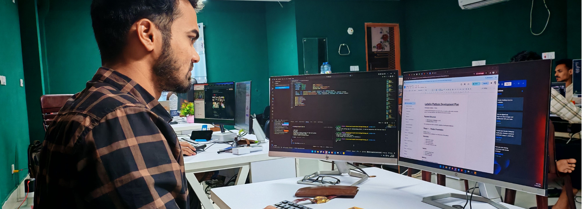Picture of someone sat at a computer coding. Picture of someone sat at a computer coding.