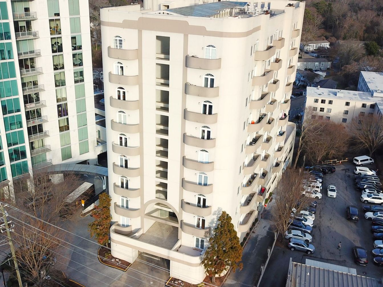 An aerial view of a tall building with a lot of windows