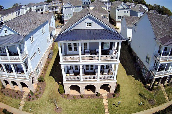 An aerial view of a house in a residential area