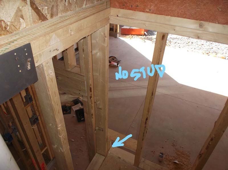 A picture of a wooden structure with the words no stud written on it
