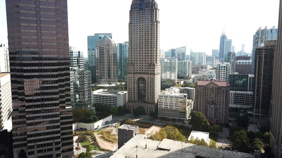 An aerial view of a city with lots of tall buildings