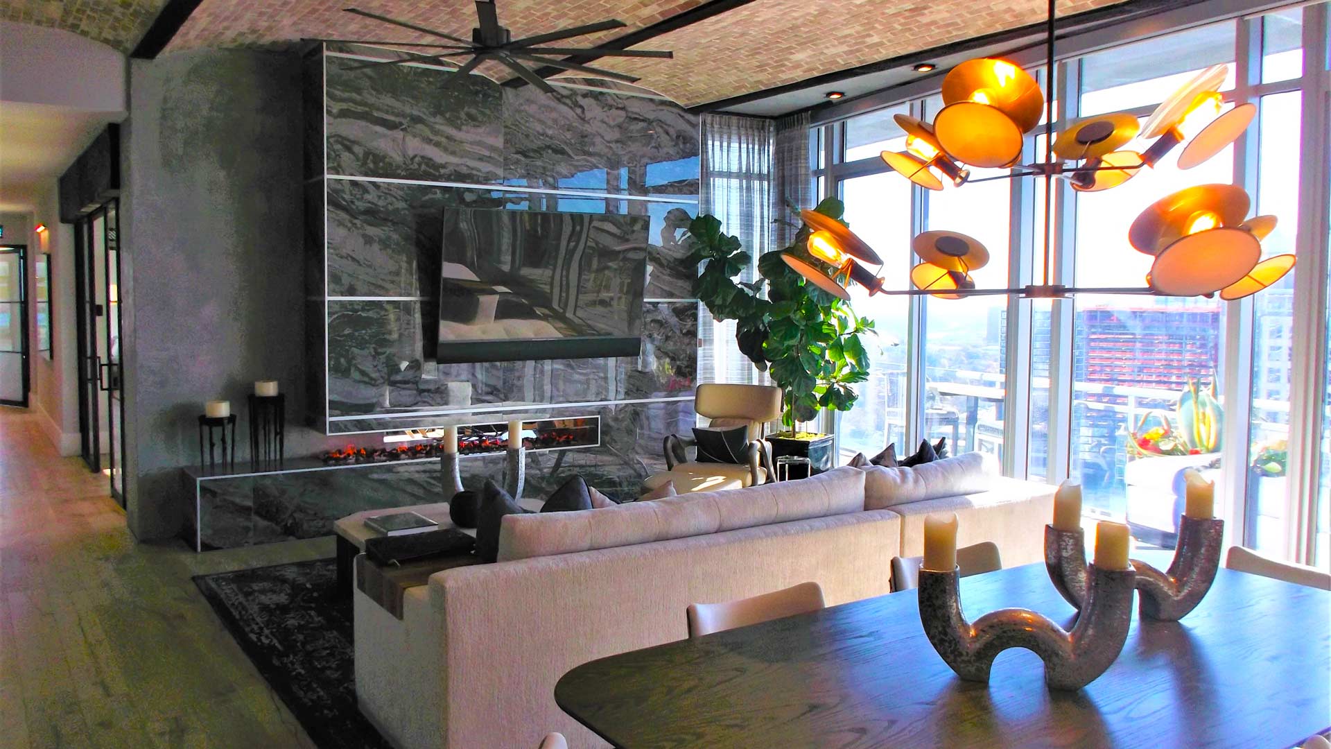 A living room with a couch and a table with candles on it
