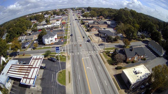 An aerial view of a highway in a small town