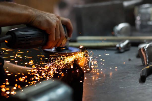 A machine is cutting a hole in a piece of metal.