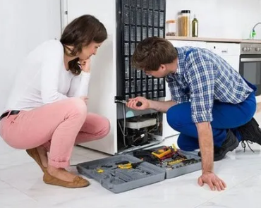 Technician Looking Over A Gas Furnace