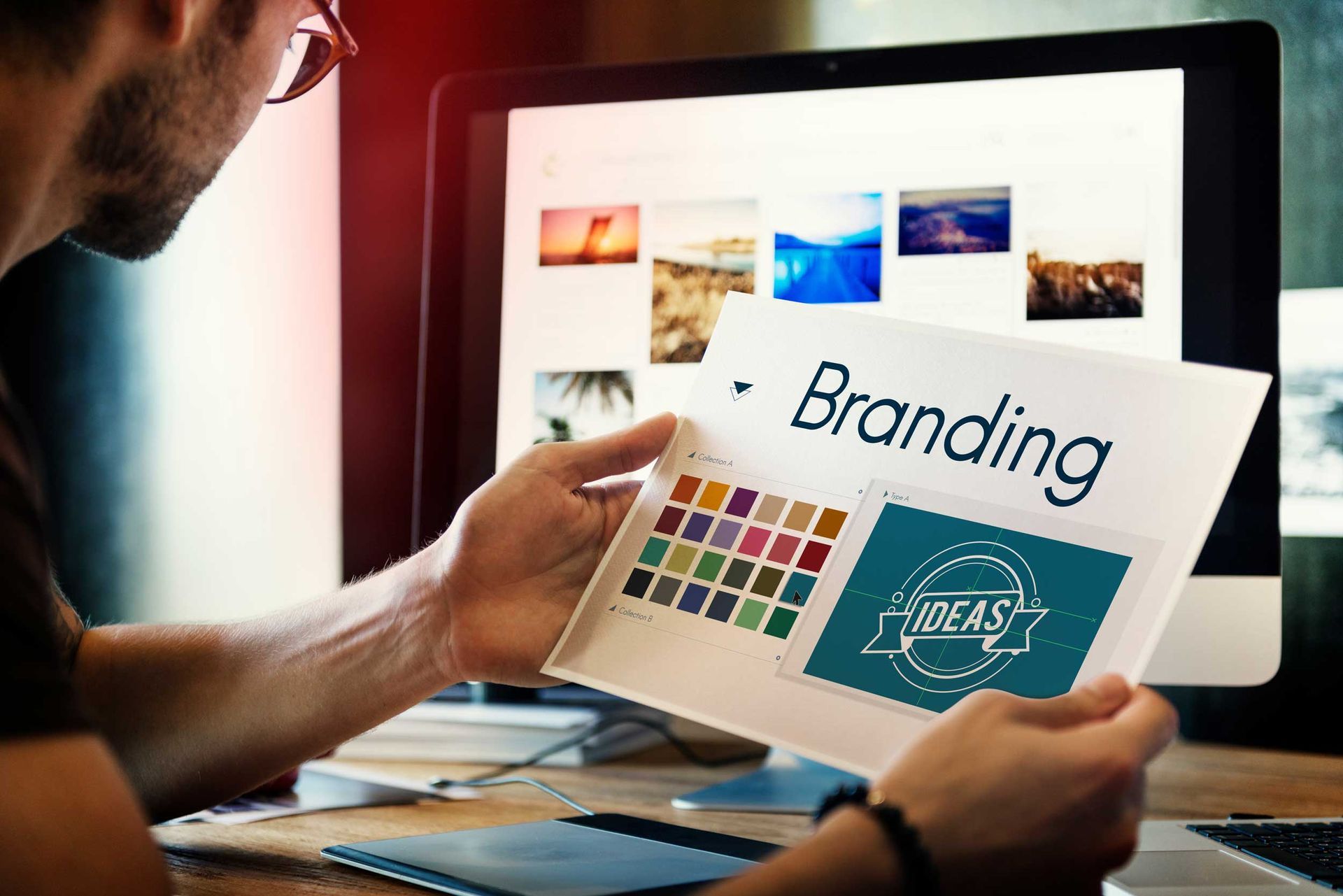 Business printing concept with branding sheet and color swatches in modern office workspace.