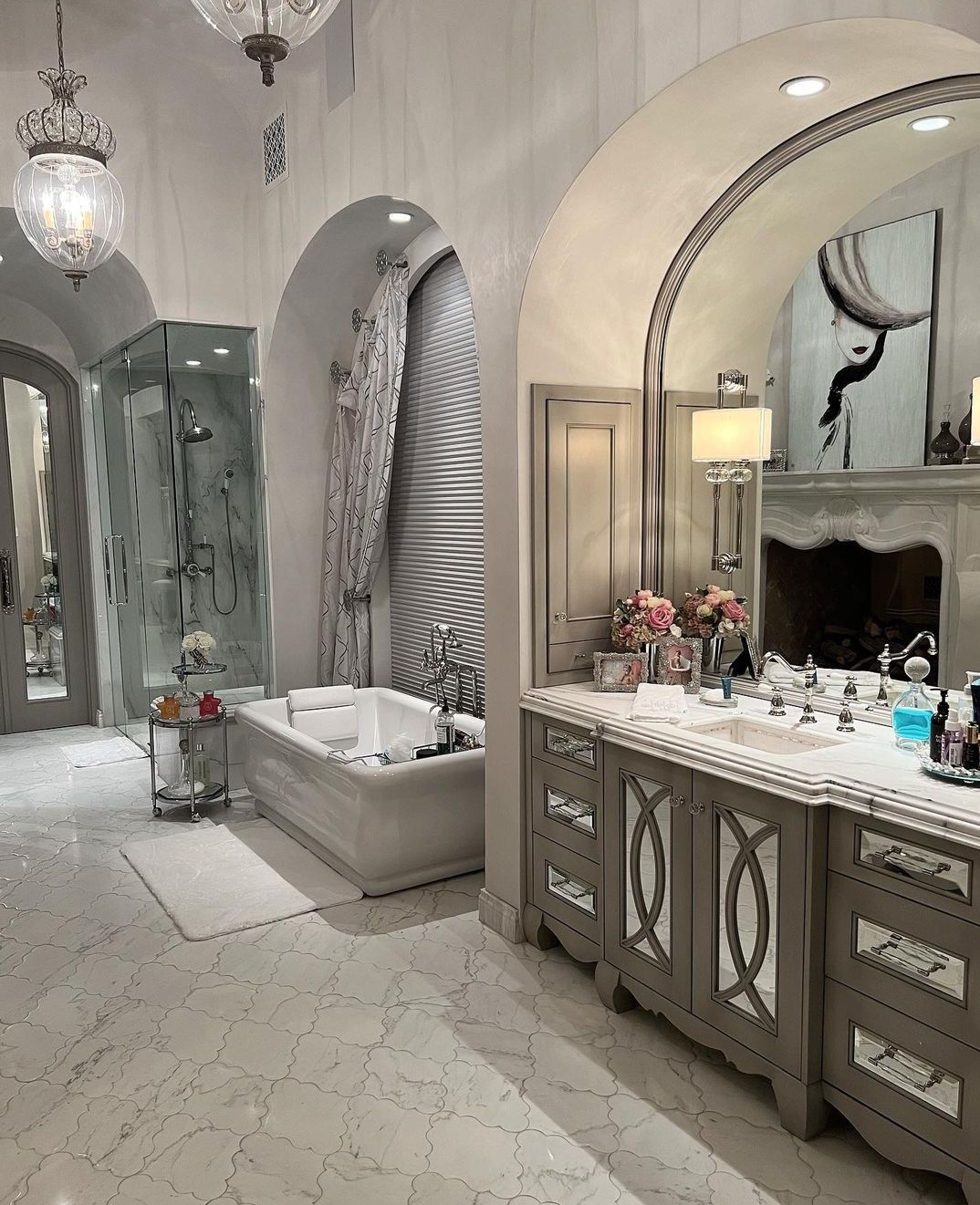 A bathroom with a bathtub and two sinks