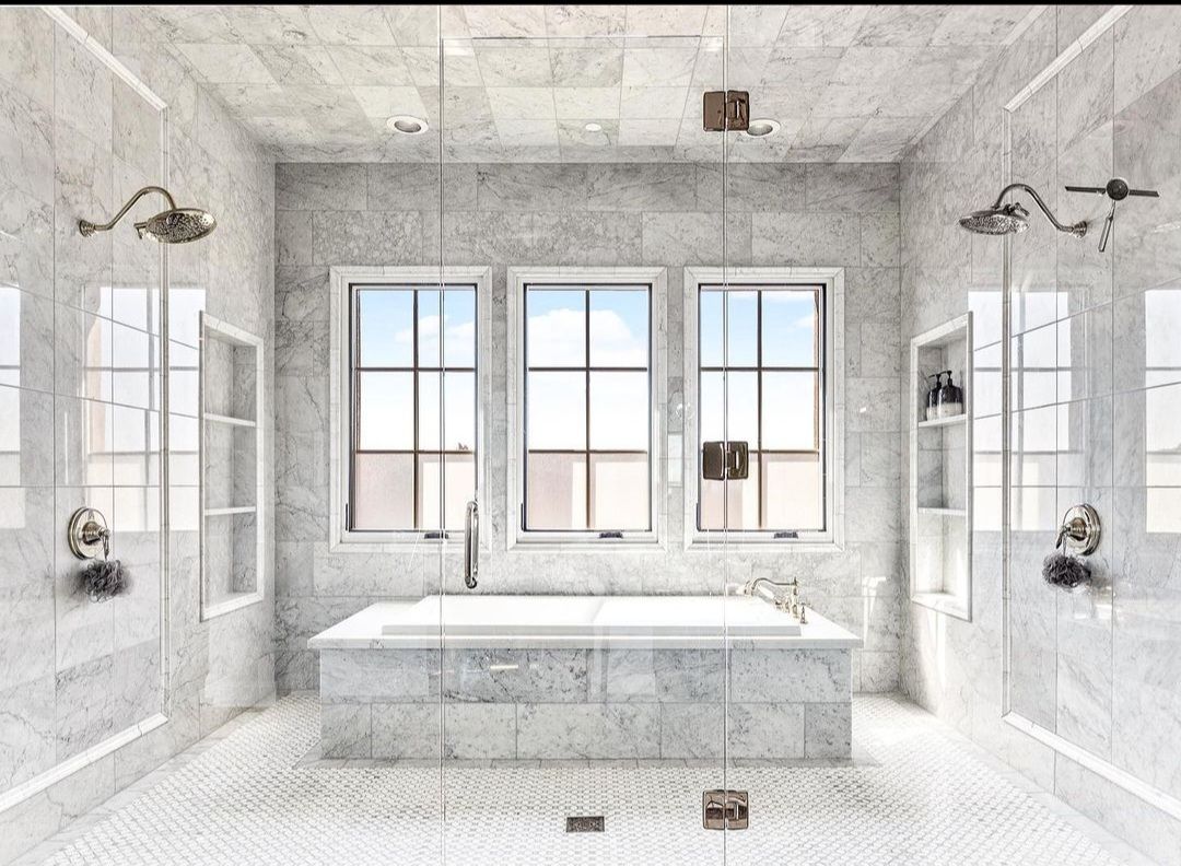A bathroom with a bathtub , shower , and three windows.