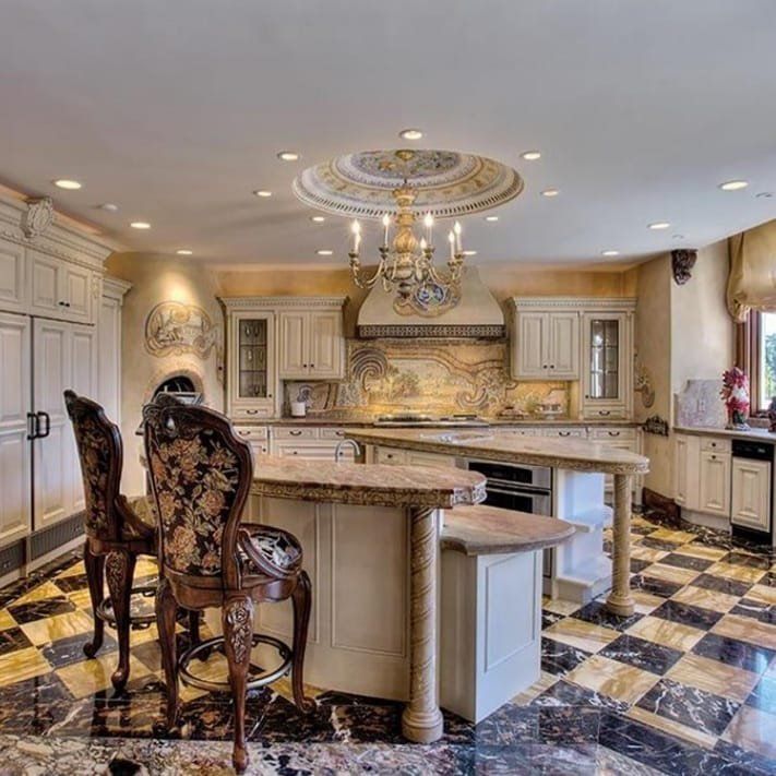 A kitchen with a large island and a checkered floor