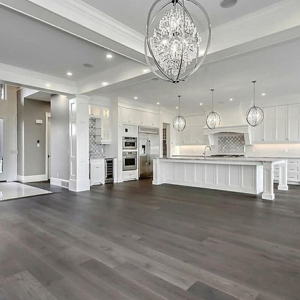 A kitchen with a sink and a stove top oven