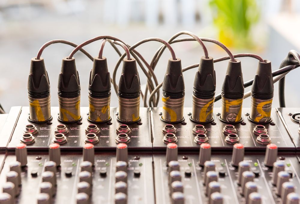 Audio Mixer With Several Plugged-in Cables and Red-lit Controls — Pacific Telephone & Data In Cardiff, NSW