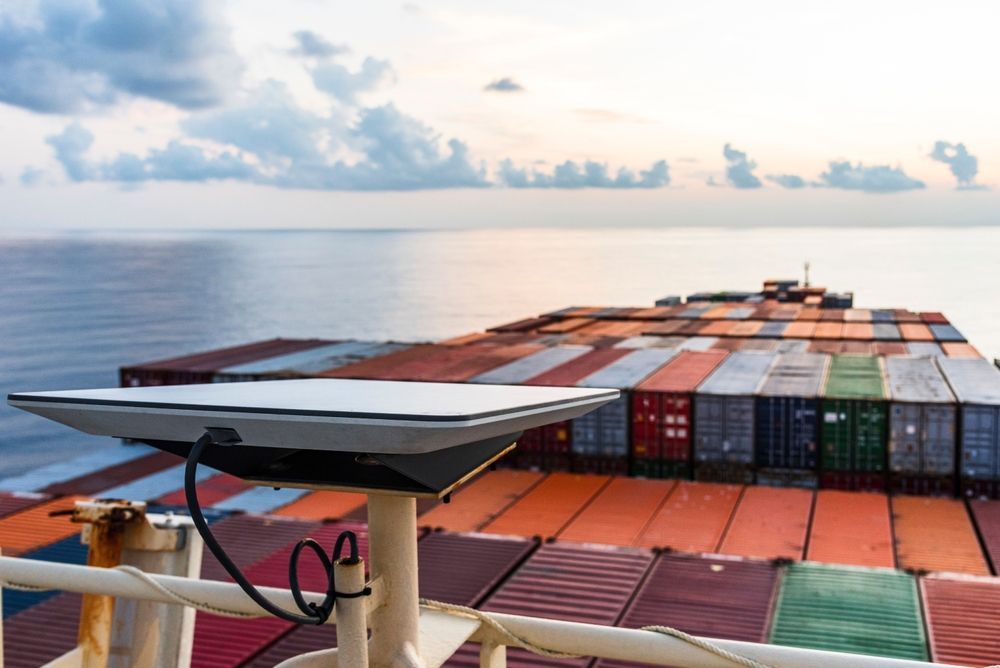 Cargo Ship Deck With Colourful Shipping Containers Sailing on Calm Sea at Sunrise — Pacific Telephone & Data In Cardiff, NSW