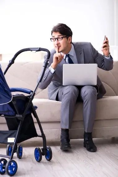 Man in Suit on Couch with Laptop — Pacific Telephone & Data In Cardiff, NSW