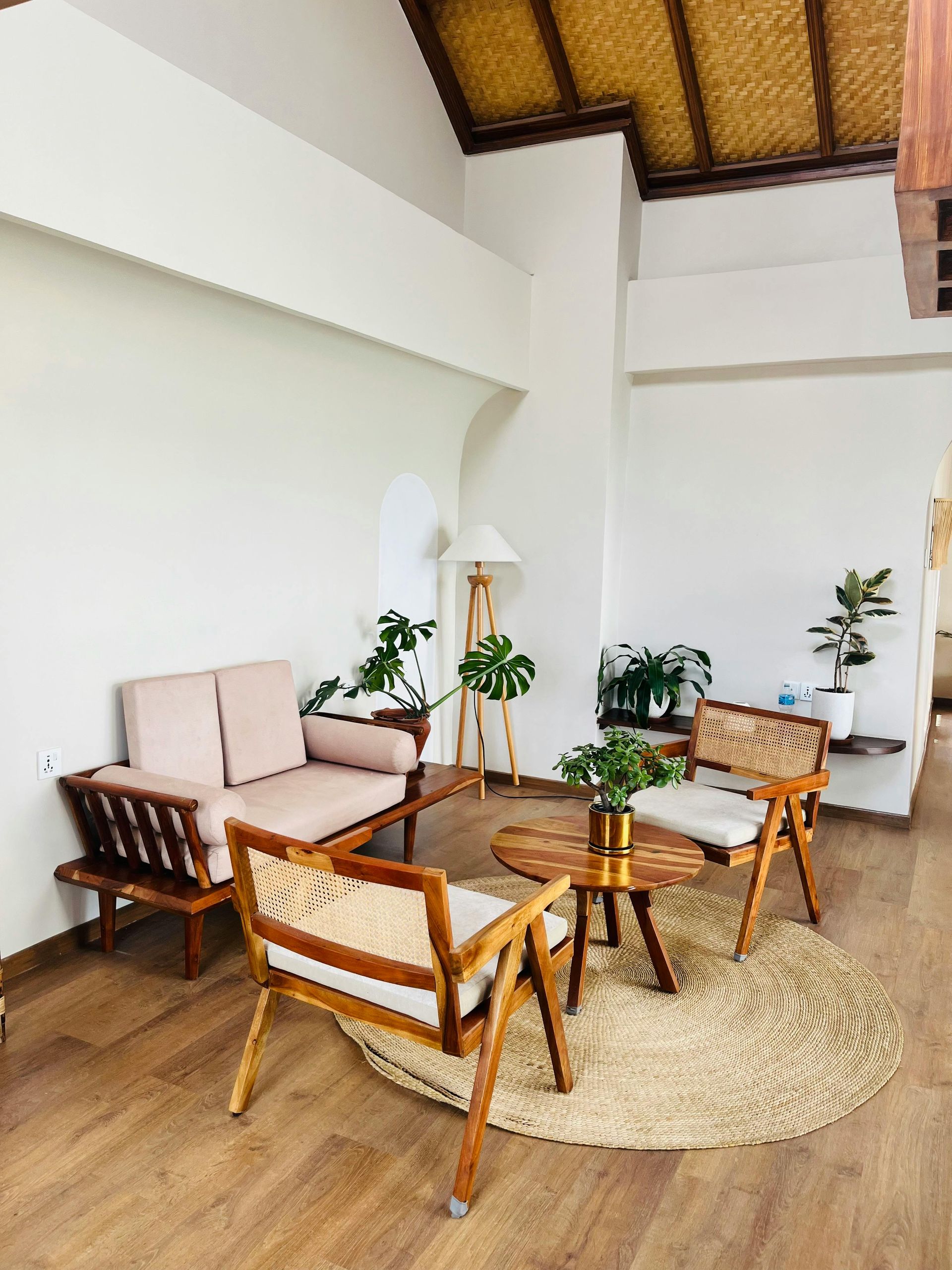 A living room with a couch , chairs , and a table.