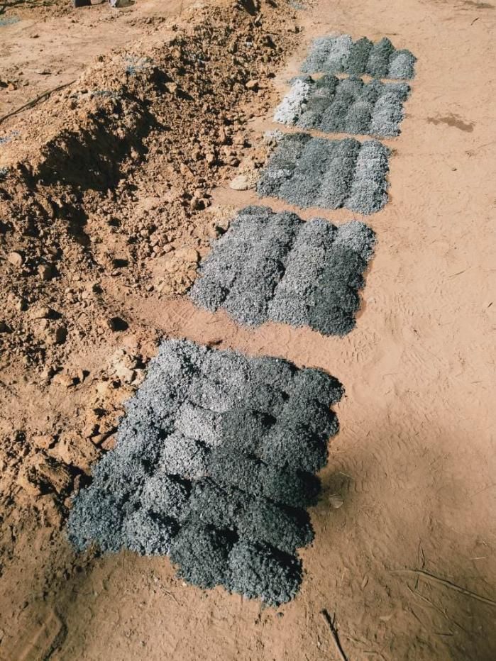 Piles of Minerals, Textured Material Laid Out on Dirt — Local Drilling Services In Nanango, QLD