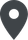 Eine schwarze Stecknadel mit einem weißen Kreis in der Mitte.