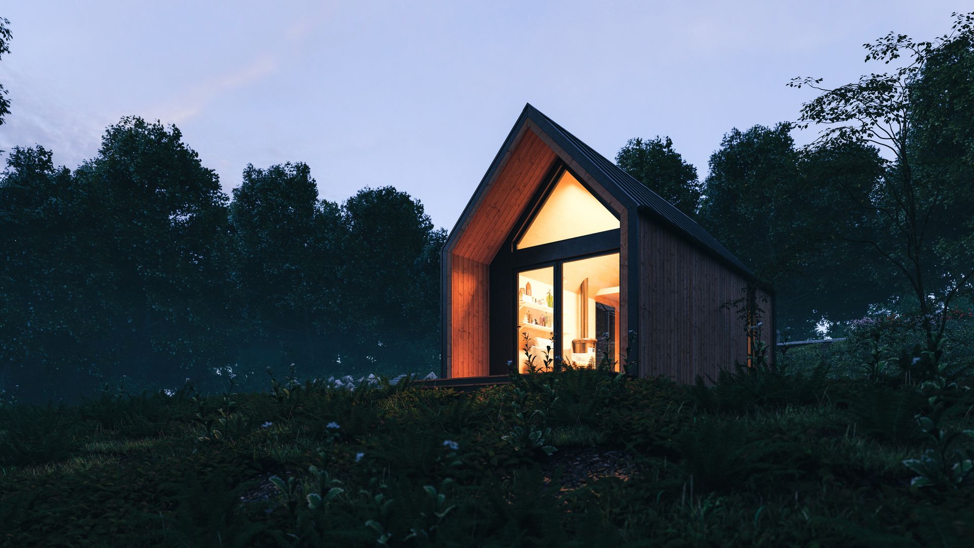 A small house is lit up at night in the middle of a forest.