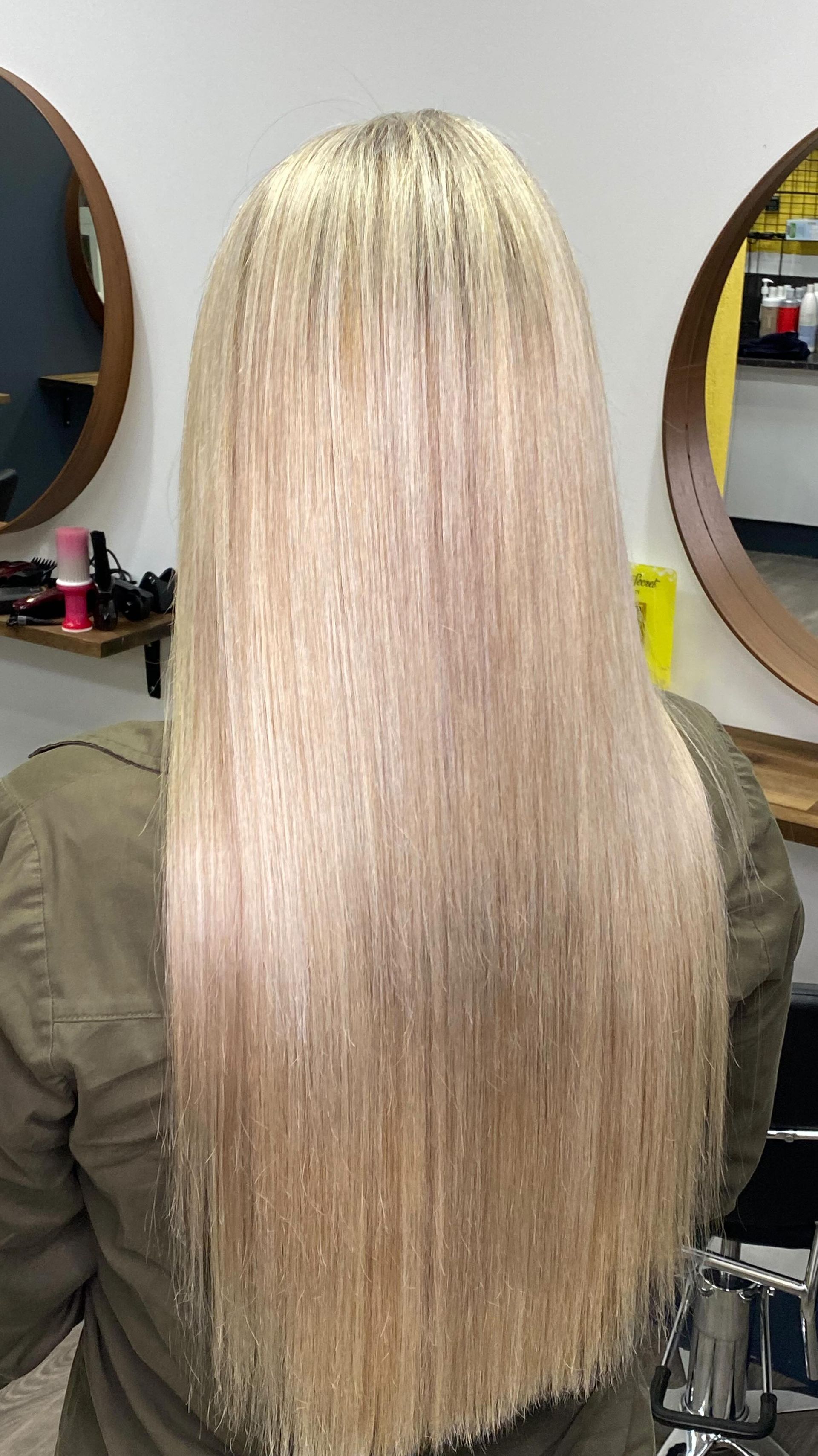 Long Straight Platinum-blonde Hair Seen From Behind In A Salon Chair, With Round Mirrors In The Background — Oh So Blonde Hair Studio in Kawana, QLD